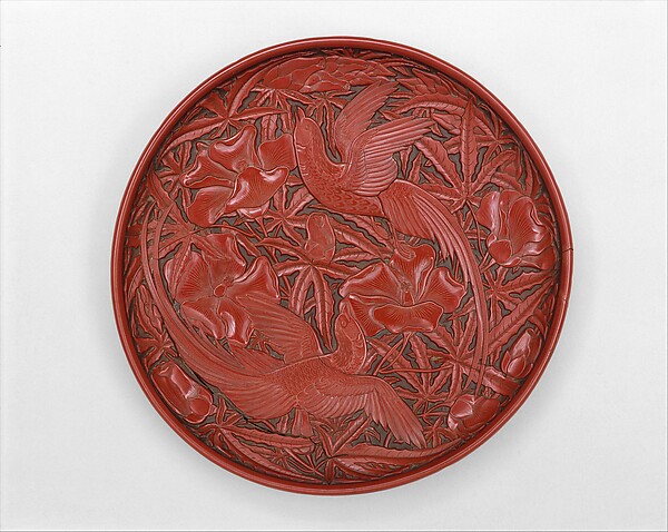 Dish with long-tailed birds and hibiscuses