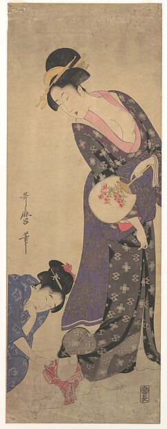 Two Women with a Baby who is Playing on the Floor