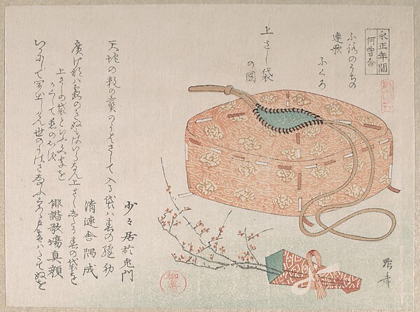 紐付きの布袋と梅の花