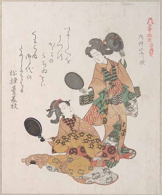 鏡を見る二人の女