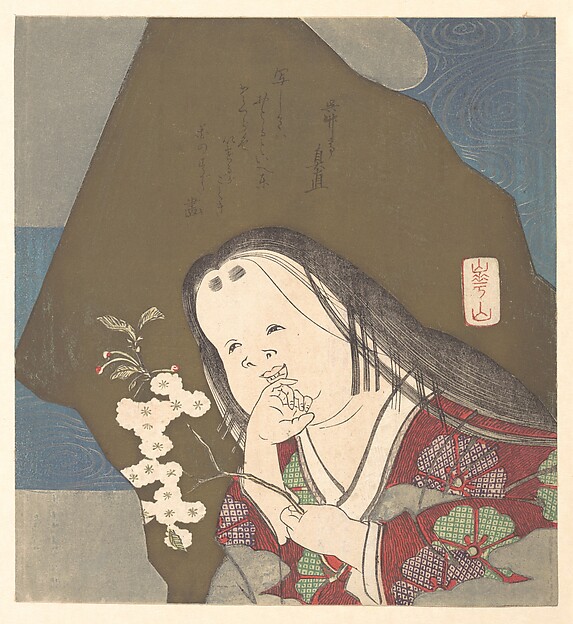 白い八重桜の枝を持つお多福