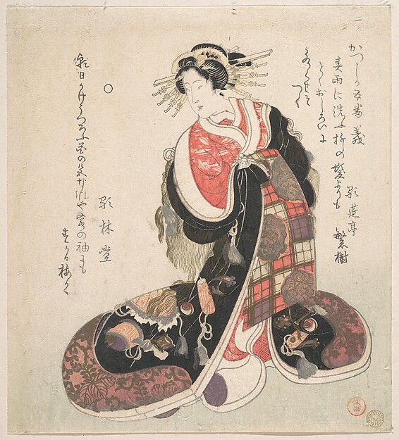 吉祥文様を刺繍した豪奢な衣裳の遊女