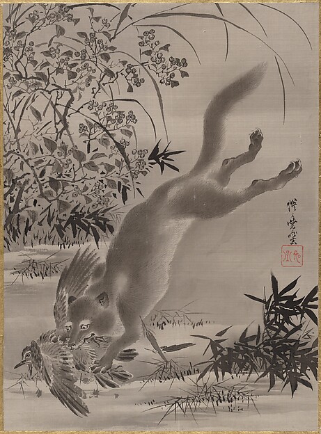 鳥を捕らえる狐