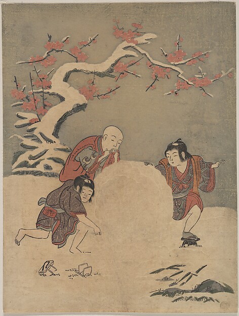 雪だるまを作る三人の子供